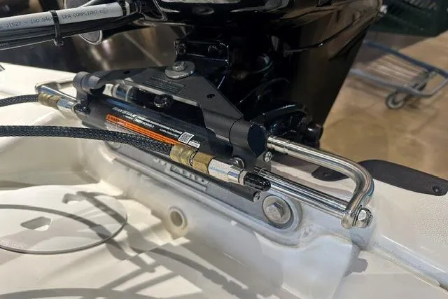 Slide: The Image of Close-up of 2026 Mako Pro Skiff 15 CC boat steering mechanism. - 4