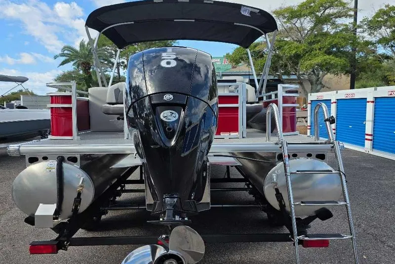 Slide: The Image of 2026 Sun Tracker Fishin' Barge 22 DLX pontoon boat with powerful outboard motor. - 3