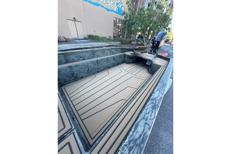Slide: The Image of 2026 Tracker Grizzly 1650 T Prairie Wings Edition boat with sleek interior design. - 5