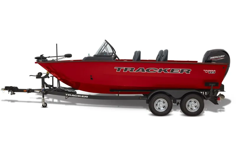 Slide: The Image of 2026 Tracker Targa V-18 Combo boat dashboard with steering wheel and gauges. - 6