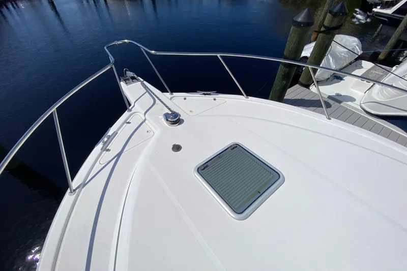 Slide: The Image of Bow view of 2000 Riviera 4000 yacht docked at marina. - 20