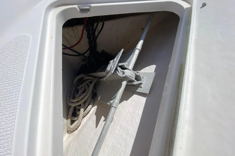 Slide: The Image of Anchor and rope storage in 2000 Riviera 4000 boat compartment. - 25