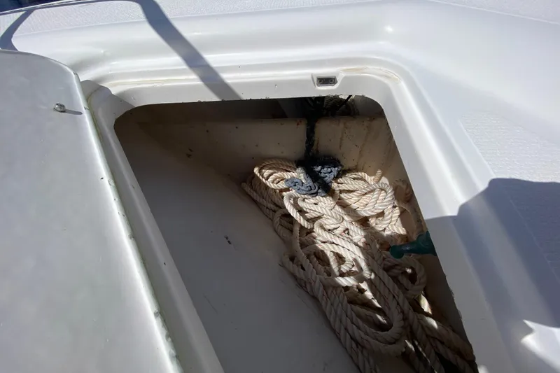 Slide: The Image of Riviera 4000 boat storage compartment with coiled ropes, 2000 model. - 26