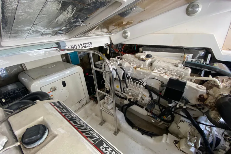 Slide: The Image of Engine room of a 2000 Riviera 4000 yacht, showcasing machinery and components. - 57