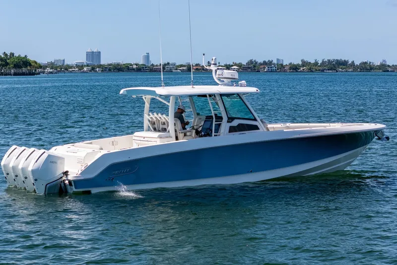 Slide: The Image of 2022 Boston Whaler 380 Outrage boat cruising on a sunny day. - 20