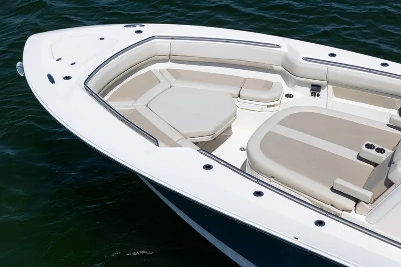 Slide: The Image of 2022 Boston Whaler 380 Outrage boat with spacious seating on calm water. - 28