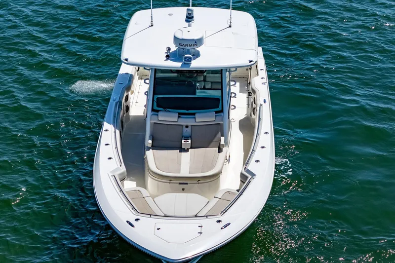 Slide: The Image of 2022 Boston Whaler 380 Outrage boat cruising on open water, aerial view. - 33