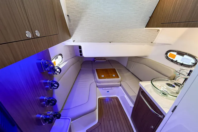 Slide: The Image of Luxurious interior of 2022 Boston Whaler 380 Outrage with seating, sink, and ambient lighting. - 66