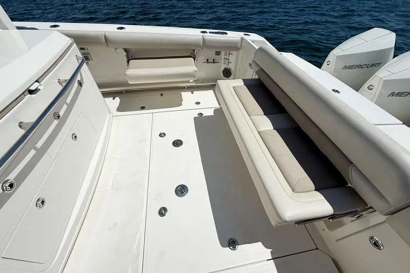 Slide: The Image of 2022 Boston Whaler 380 Outrage boat interior with seating and Mercury engines. - 87