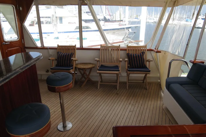 Slide: The Image of Luxurious 1964 Striker Cockpit interior with seating, bar, and waterfront view. - 10