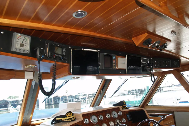 Slide: The Image of 1964 Striker Cockpit with wooden interior, steering wheel, and navigation instruments. - 13