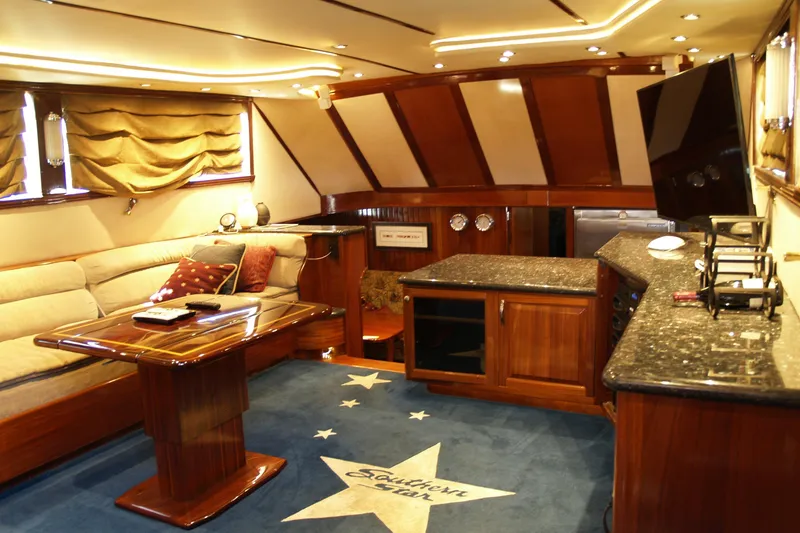 Slide: The Image of Interior of 1964 Striker Cockpit with nautical-themed cushions and wooden accents. - 16