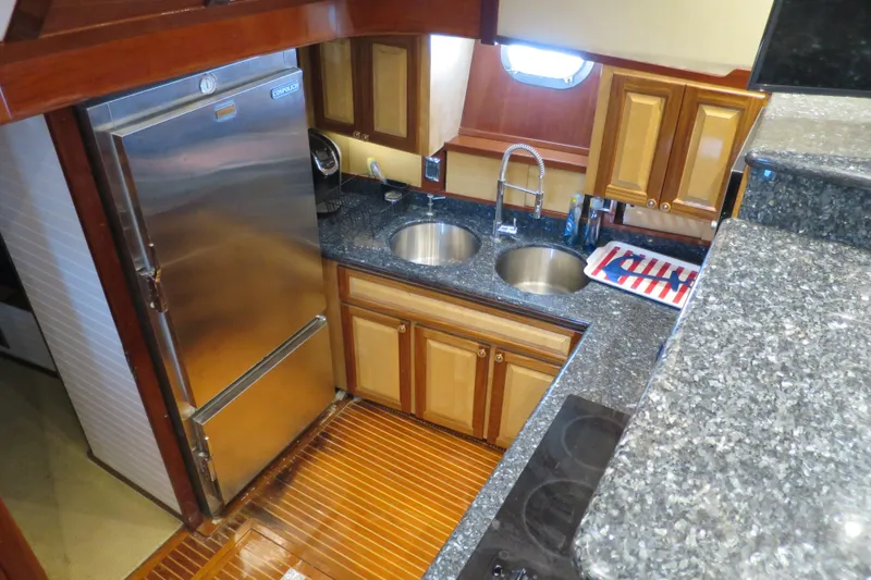 Slide: The Image of Luxurious 1964 Striker Cockpit interior with plush seating, elegant table, and nautical decor. - 18