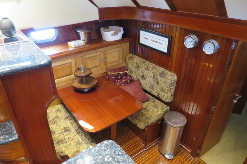 Slide: The Image of 1964 Striker Cockpit kitchen with granite countertops, stainless steel fridge, and dual sinks. - 19