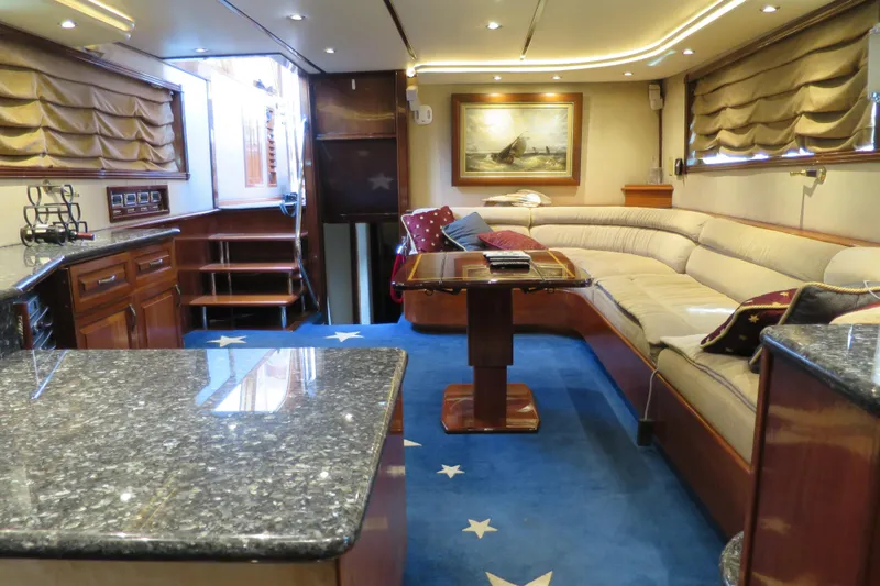 Slide: The Image of 1964 Striker Cockpit interior with wooden dining area, patterned cushions, and decorative elements. - 21