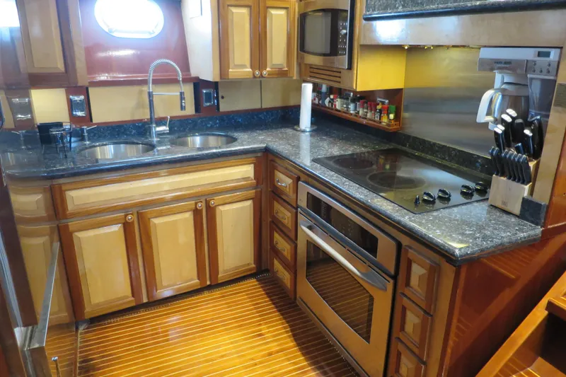 Slide: The Image of 1964 Striker Cockpit interior with cozy seating, decorative pillows, and a well-stocked bar. - 26