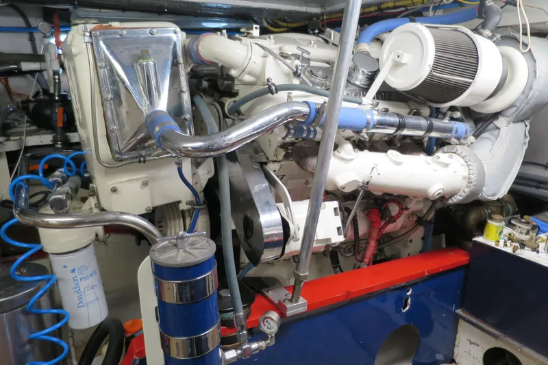 Slide: The Image of Engine room of a 1964 Striker Cockpit boat with visible machinery and components. - 40