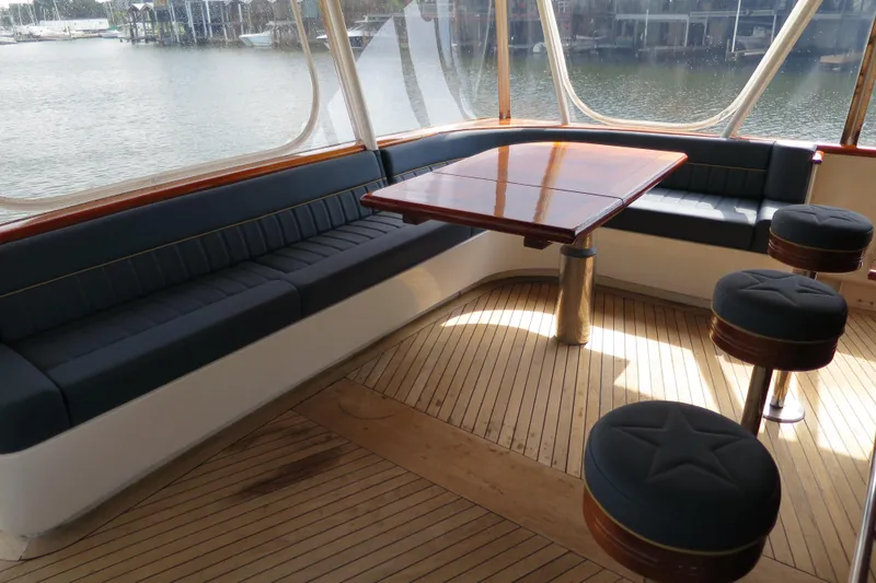 Slide: The Image of 1964 Striker Cockpit boat deck with wooden flooring and nautical equipment. - 7