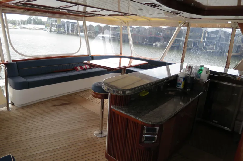Slide: The Image of Luxurious 1964 Striker Cockpit interior with bar, stools, and wooden accents. - 9