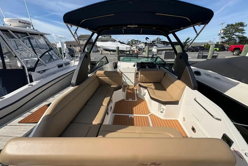 Slide: The Image of 2018 Sea Ray SDX 250 Outboard boat with spacious seating and sleek design. - 2