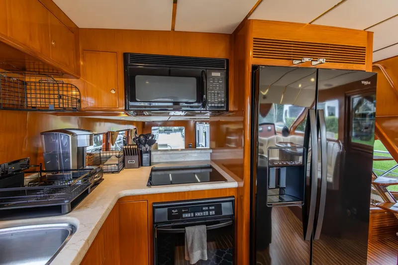 Slide: The Image of Luxurious kitchen in 2005 Ocean Alexander Raised Pilothouse Flybridge Sedan yacht. - 10