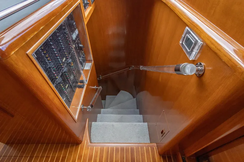 Slide: The Image of Staircase with control panel on 2005 Ocean Alexander Raised Pilothouse Flybridge Sedan yacht. - 12