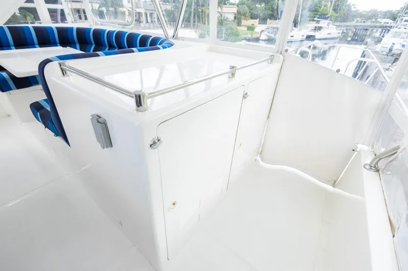 Slide: The Image of 2005 Ocean Alexander Raised Pilothouse Flybridge Sedan interior with seating and storage. - 26
