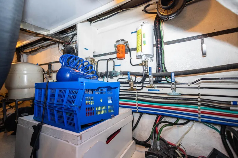 Slide: The Image of Engine room of 2005 Ocean Alexander Raised Pilothouse Flybridge Sedan with organized piping and equipment. - 41