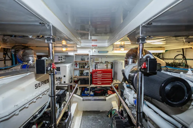 Slide: The Image of Engine room of 2005 Ocean Alexander Raised Pilothouse Flybridge Sedan, featuring organized equipment and tools. - 45