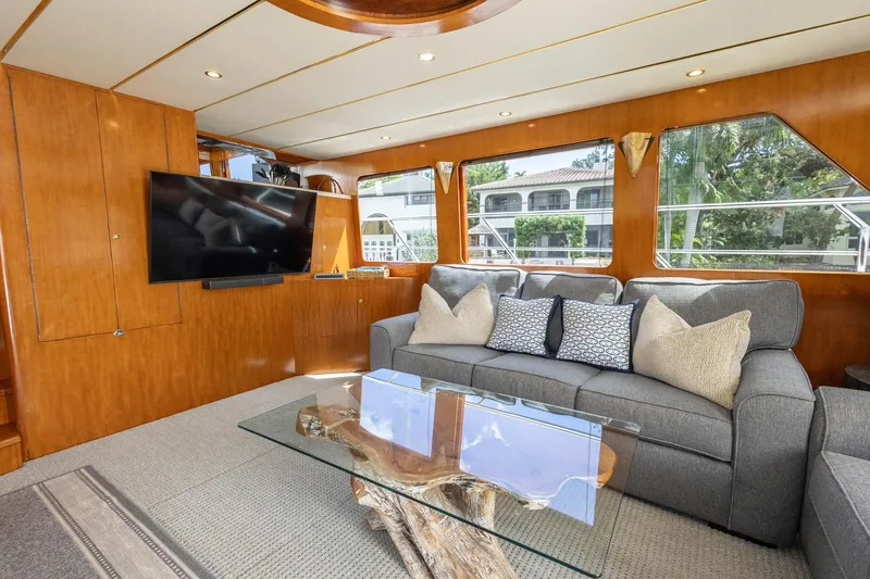 Slide: The Image of Luxurious 2005 Ocean Alexander Raised Pilothouse Flybridge Sedan interior with plush seating and modern decor. - 6