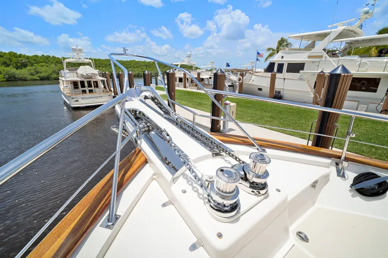 Slide: The Image of Bow view of 2017 Fleming 65 yacht docked at marina under blue sky. - 38