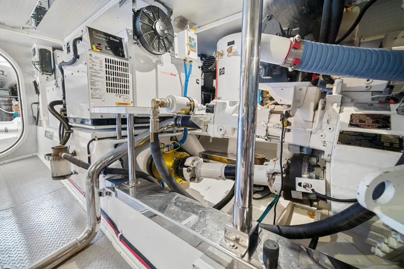 Slide: The Image of Engine room of a 2017 Fleming 65 yacht, featuring Cummins Onan generator. - 43