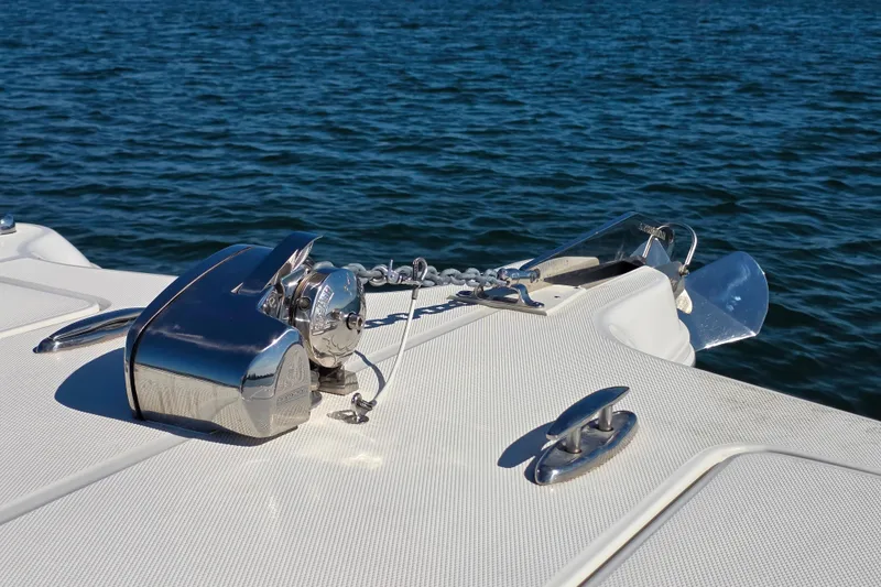 Slide: The Image of 2024 World Cat 325 CC boat anchor system on calm water. - 16