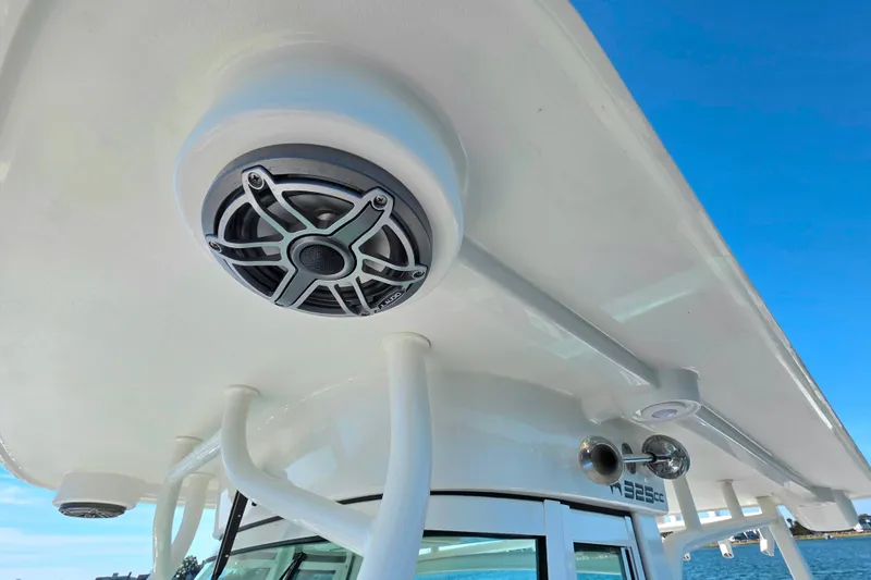 Slide: The Image of 2024 World Cat 325 CC boat with speaker and horn on the roof. - 18