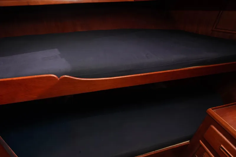 Slide: The Image of Interior of 1982 CHB Classic Trawler 41, featuring wooden bunk beds. - 29