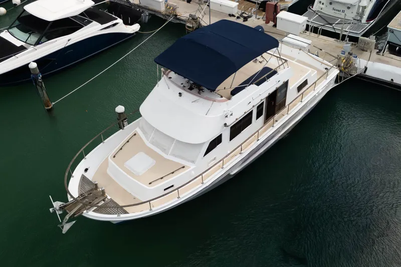 Slide: The Image of 1982 CHB Classic Trawler 41 docked in marina, aerial view. - 5