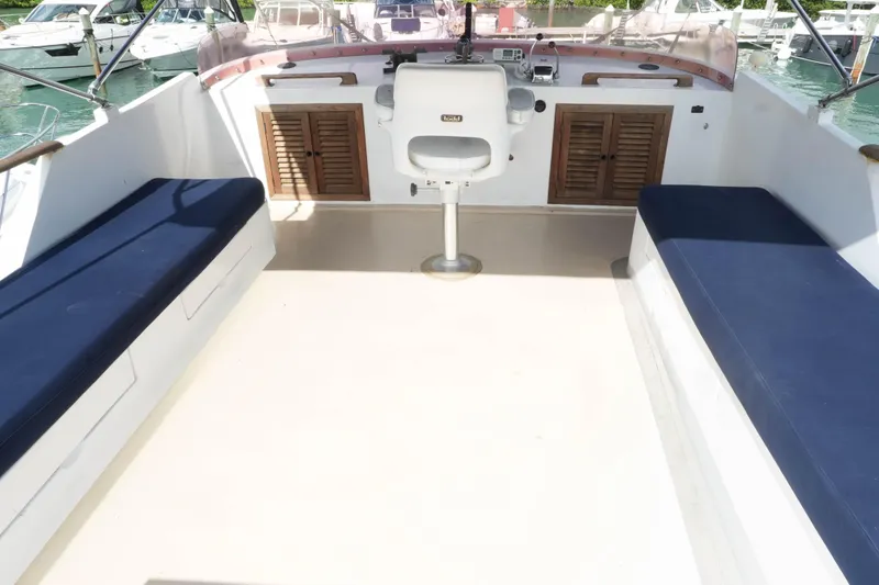 Slide: The Image of 1982 CHB Classic Trawler 41 deck with seating and helm station. - 7