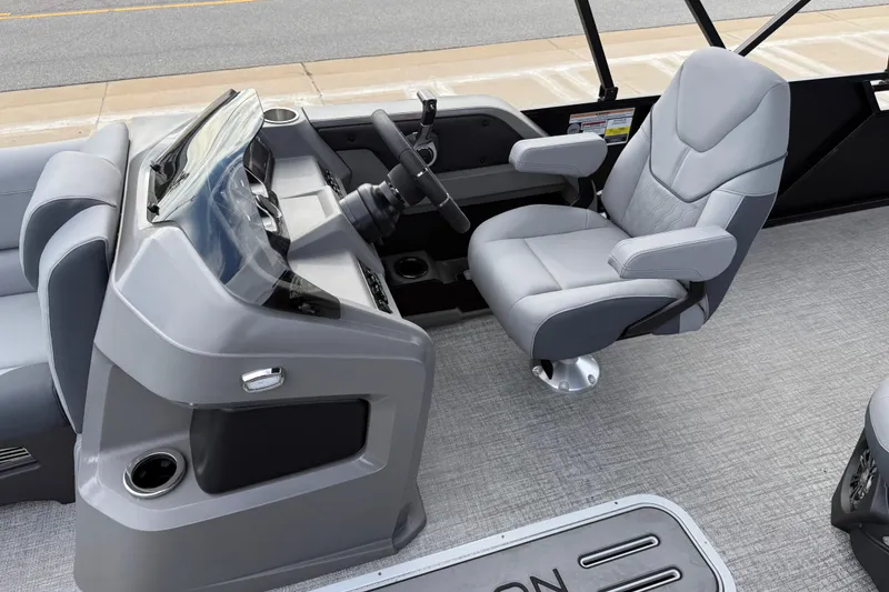 Slide: The Image of 2026 Avalon LSZ Rear Fish boat interior with modern helm and comfortable captain's chair. - 16
