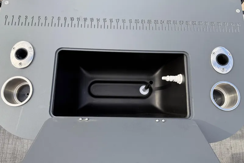 Slide: The Image of 2026 Avalon LSZ Rear Fish boat console with built-in measuring ruler and cup holders. - 22