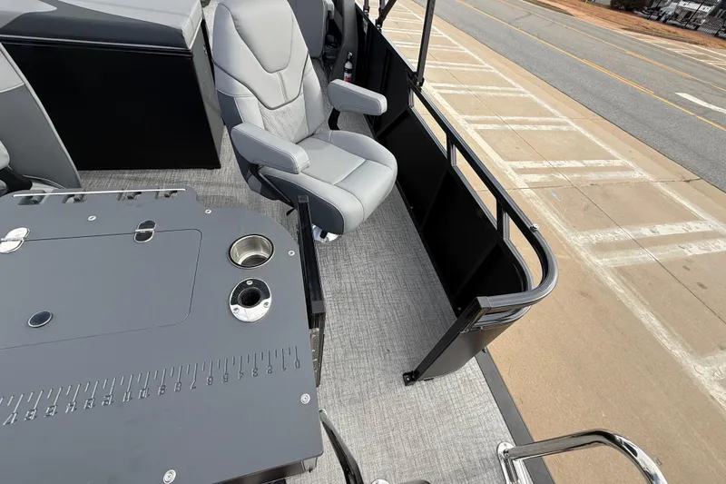 Slide: The Image of 2026 Avalon LSZ Rear Fish boat interior with gray seating and fishing station. - 24
