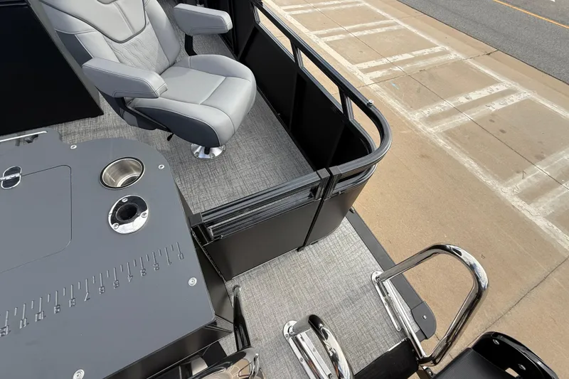 Slide: The Image of 2026 Avalon LSZ Rear Fish boat interior with gray seating and fishing station. - 25