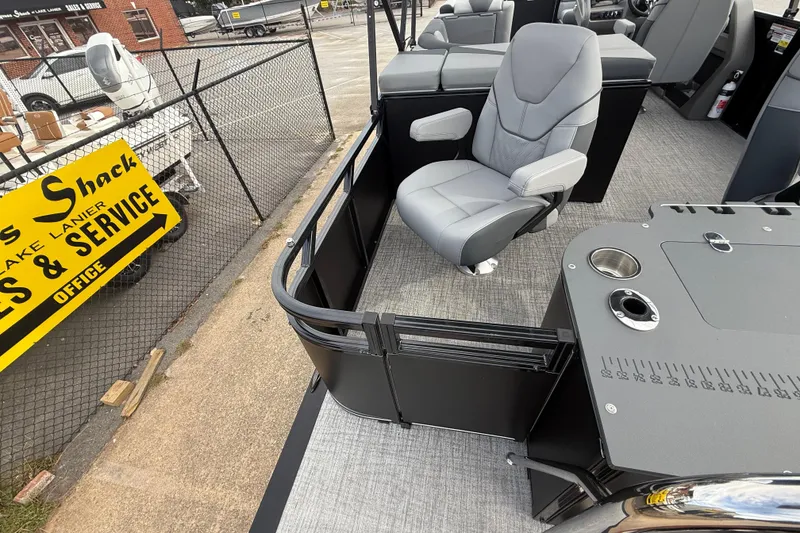 Slide: The Image of 2026 Avalon LSZ Rear Fish boat interior with gray seating and fishing station. - 26