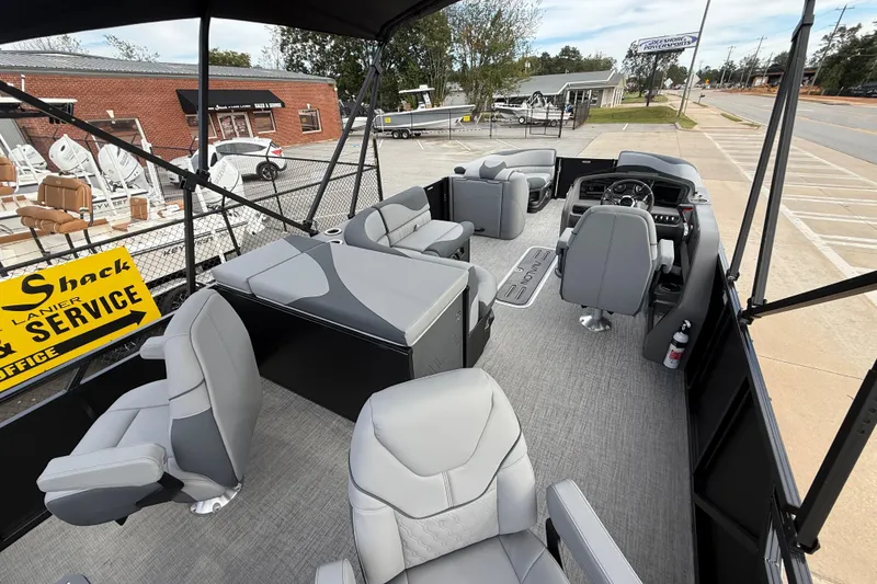 Slide: The Image of 2026 Avalon LSZ Rear Fish pontoon boat interior with modern seating and steering console. - 29