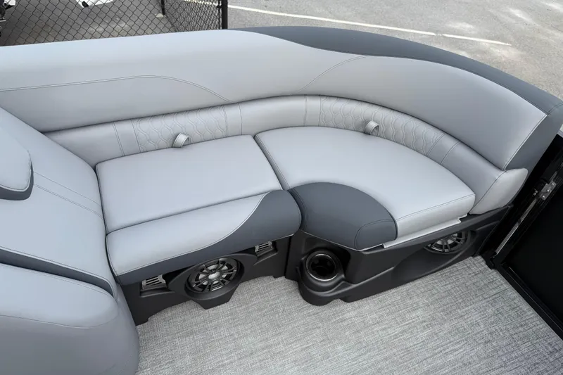 Slide: The Image of Luxurious seating in 2026 Avalon LSZ Rear Fish boat, featuring sleek gray upholstery and integrated speakers. - 36