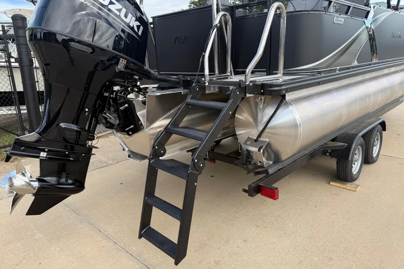 Slide: The Image of 2026 Avalon LSZ Rear Fish pontoon boat with Suzuki outboard motor and trailer. - 4