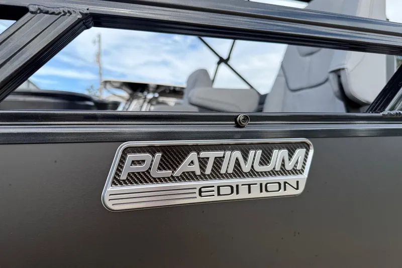 Slide: The Image of 2026 Avalon LSZ Rear Fish Platinum Edition badge on sleek boat exterior. - 7