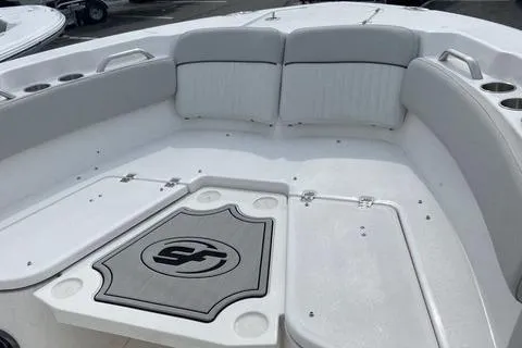 Slide: The Image of 2022 Sea Fox 228 Commander boat interior with cushioned seating and cup holders. - 10