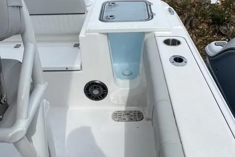 Slide: The Image of 2022 Sea Fox 228 Commander boat interior with seating, storage, and cup holders. - 12