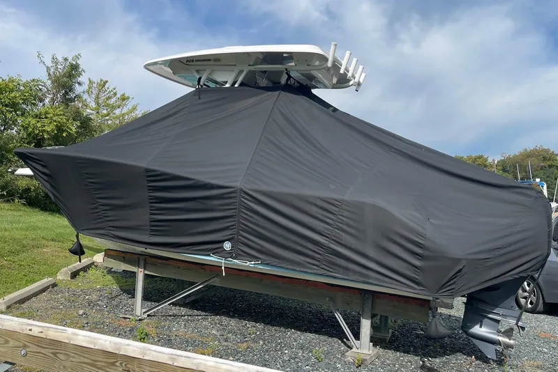 Slide: The Image of Covered 2022 Sea Fox 228 Commander boat on a trailer, outdoors under a cloudy sky. - 15