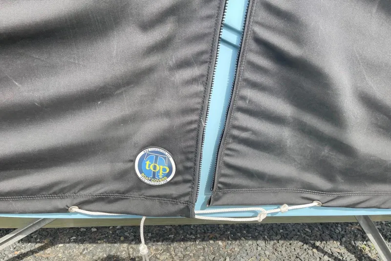 Slide: The Image of Black boat cover with logo on a 2022 Sea Fox 228 Commander. - 16